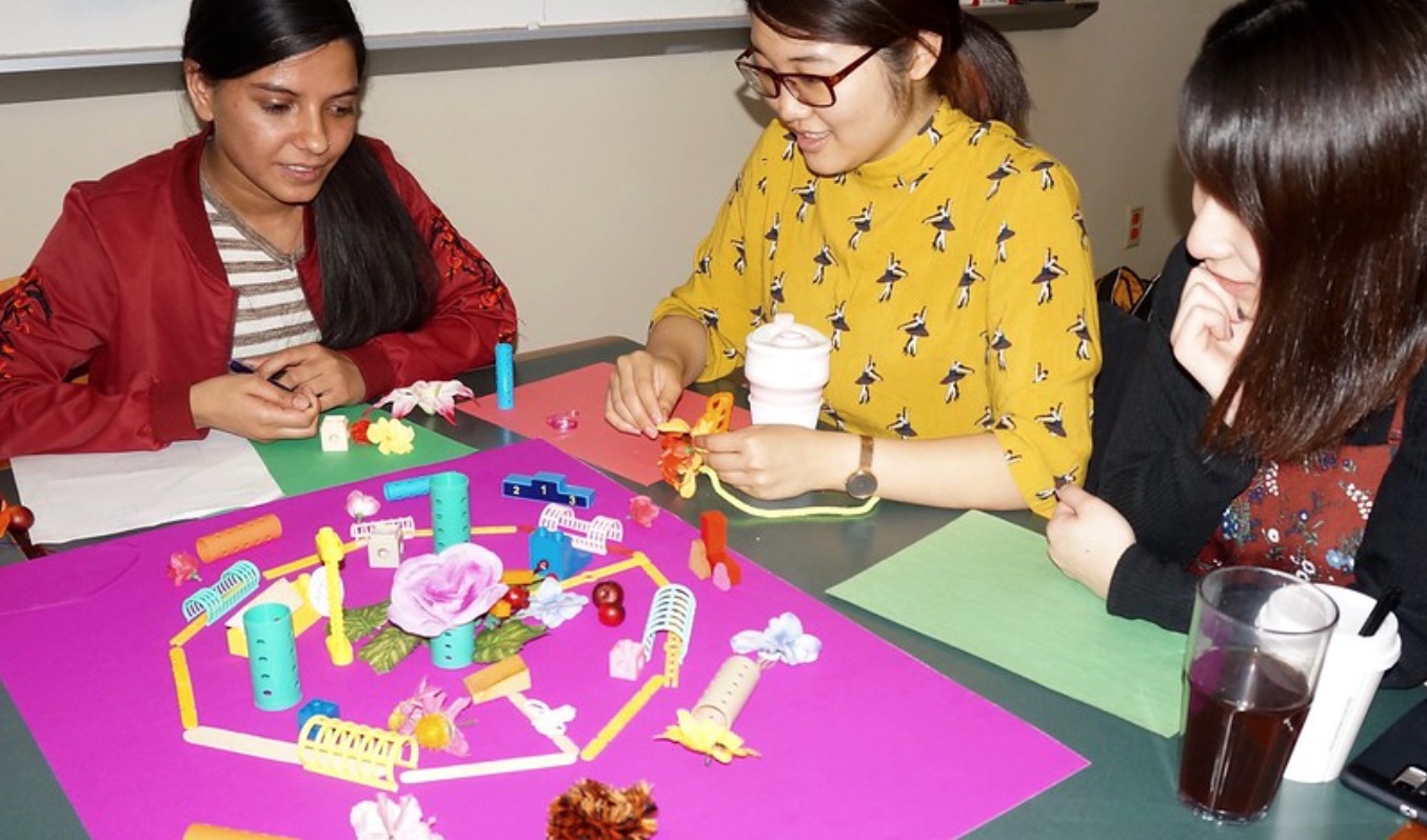 Students at Soka University building a model of their ideal community.